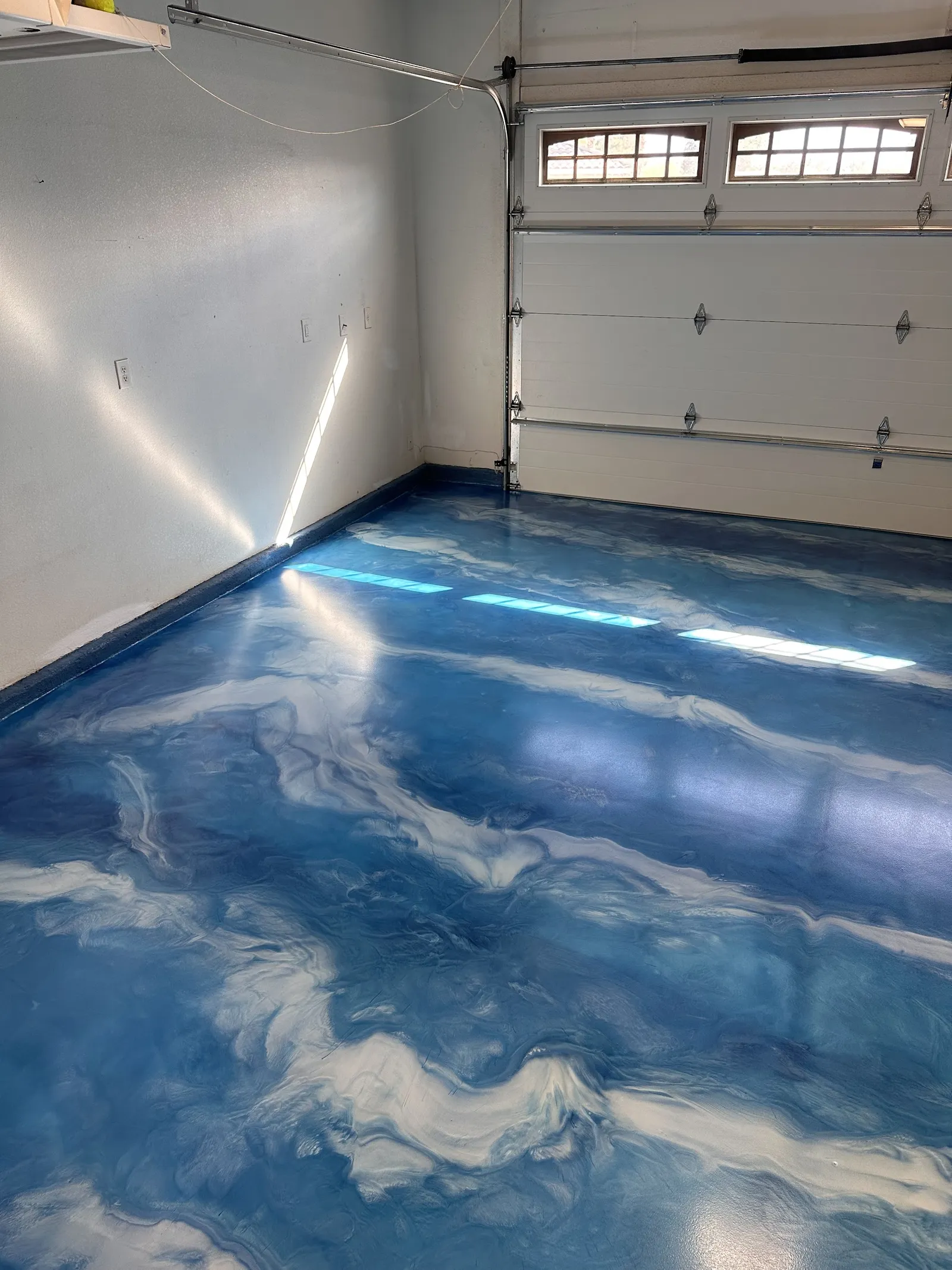 Metallic epoxy floor installed in an interior space